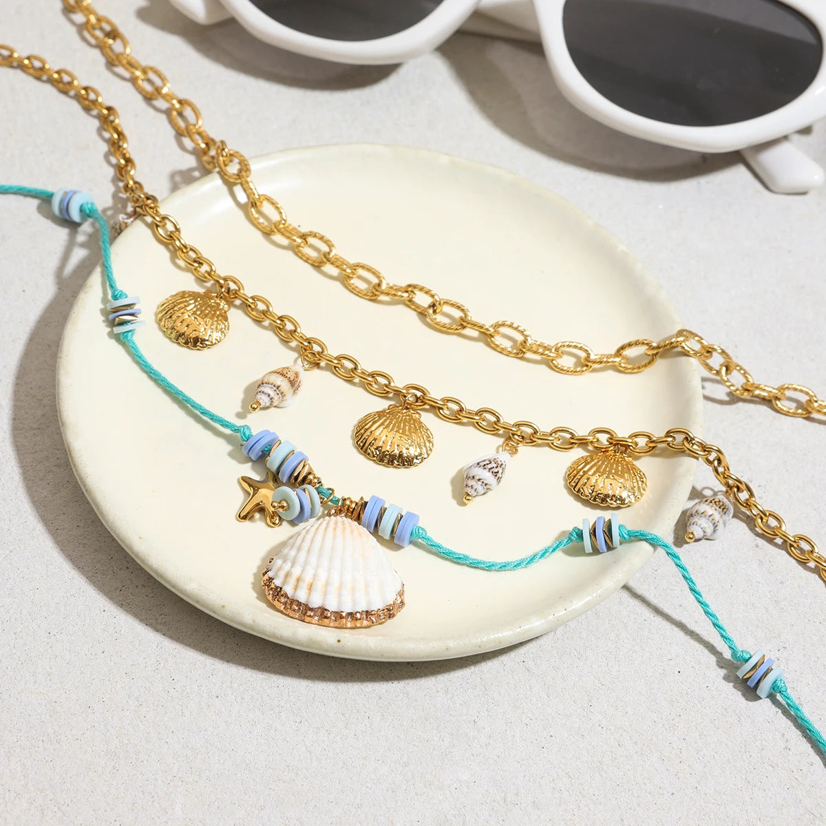 Collier coquillage & étoile – Fils perlés bleu