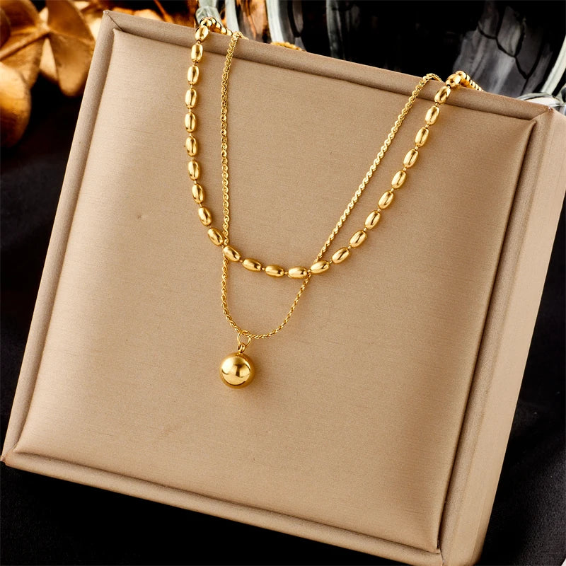 Collier ras-du-cou boule géométrique