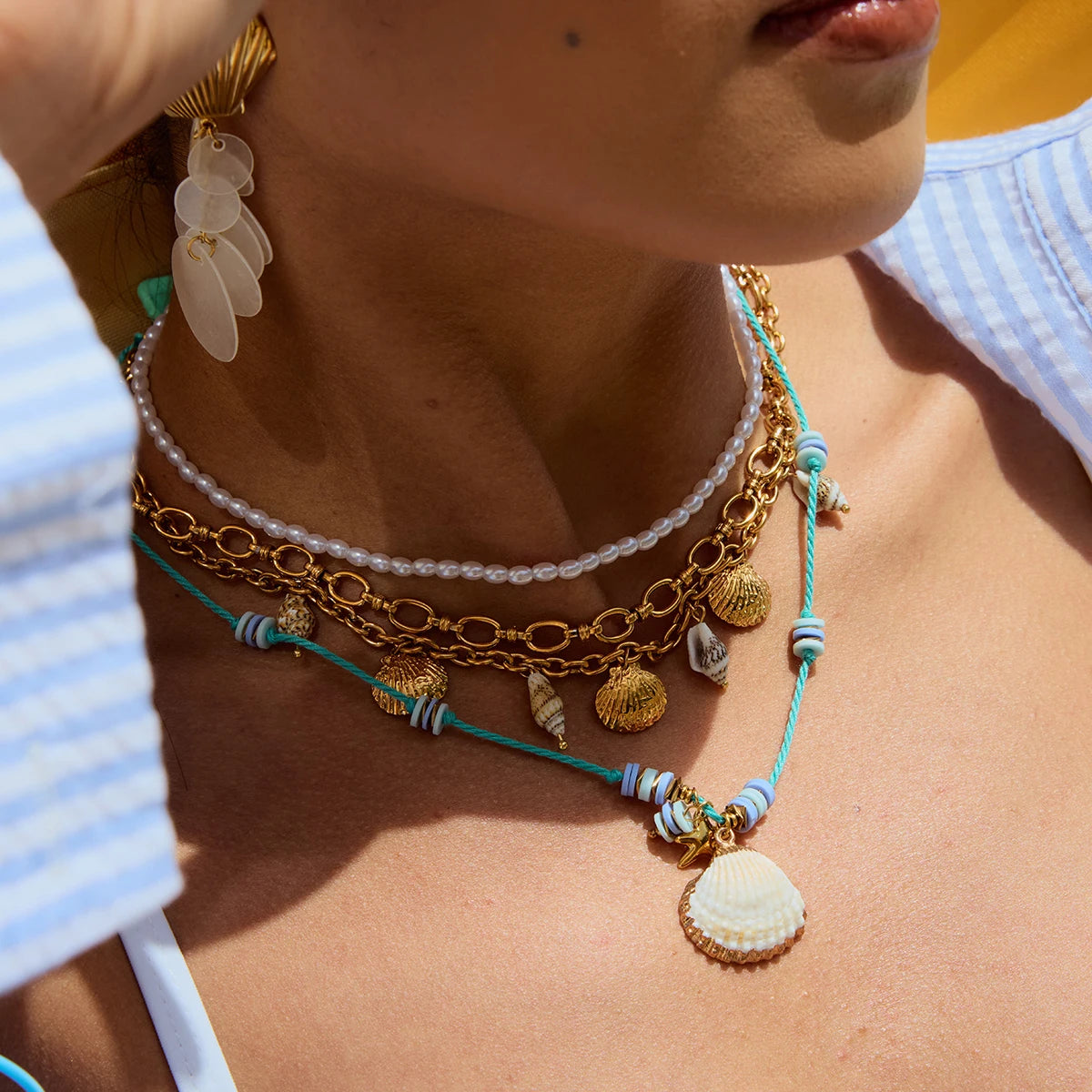 Collier coquillage & étoile – Fils perlés bleu